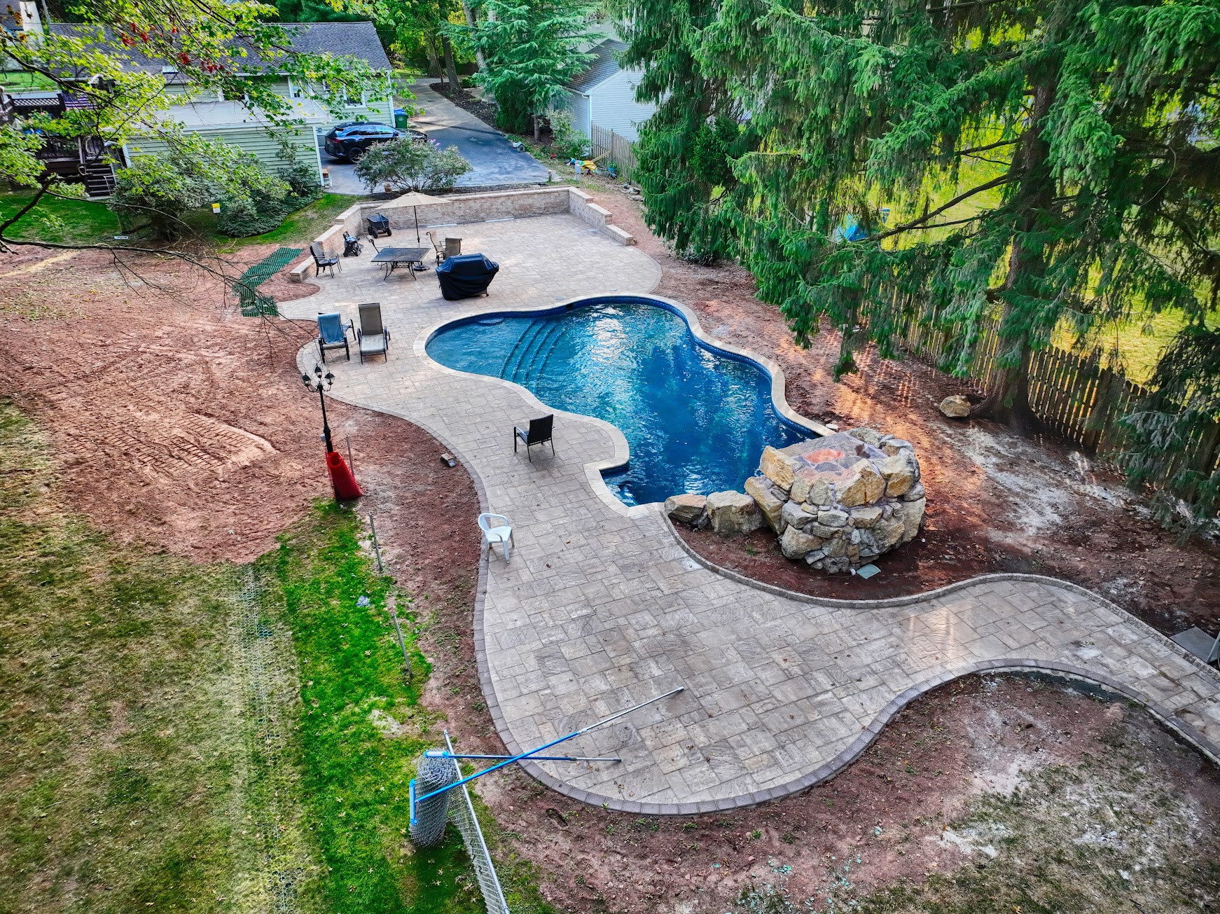 Aerial view of pool and paver patio installation