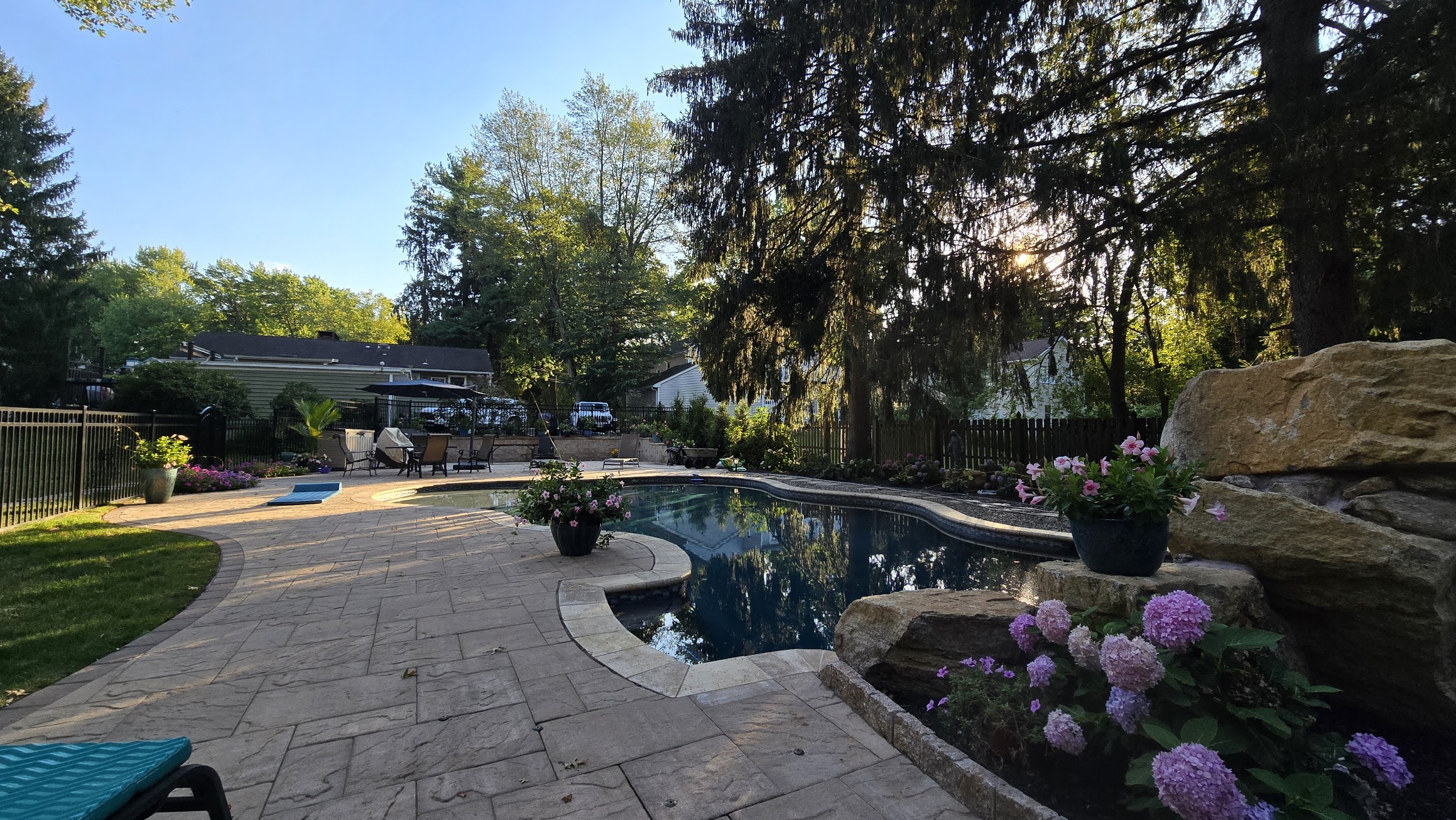 Pool and paver patio with landscaping